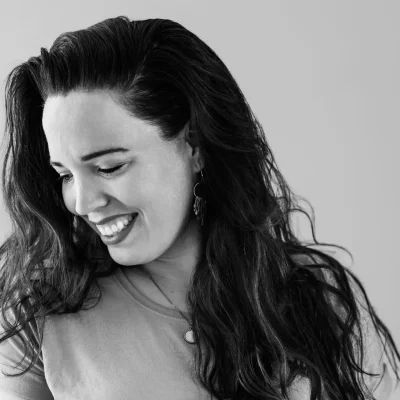 a woman with long hair smiling