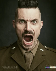 a man in a uniform with his mouth open